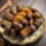 An assortment of chocolate-covered traditional Turkish sweets on a decorative plate