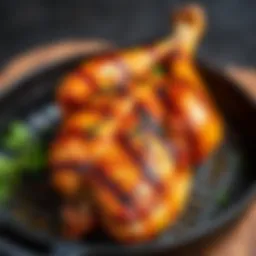 A beautifully grilled chicken on a cast iron skillet with herbs
